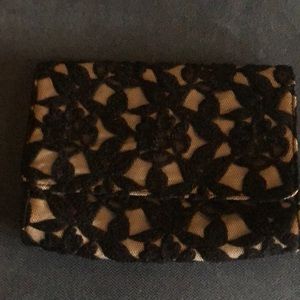 Neiman Marcus black lace and beige clutch